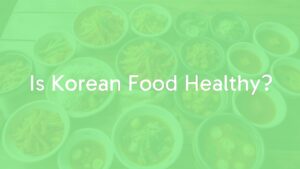 Colorful spread of healthy Korean food including kimchi, side dishes (banchan), and soups (kuk) on a wooden table, bright and fresh, realistic.